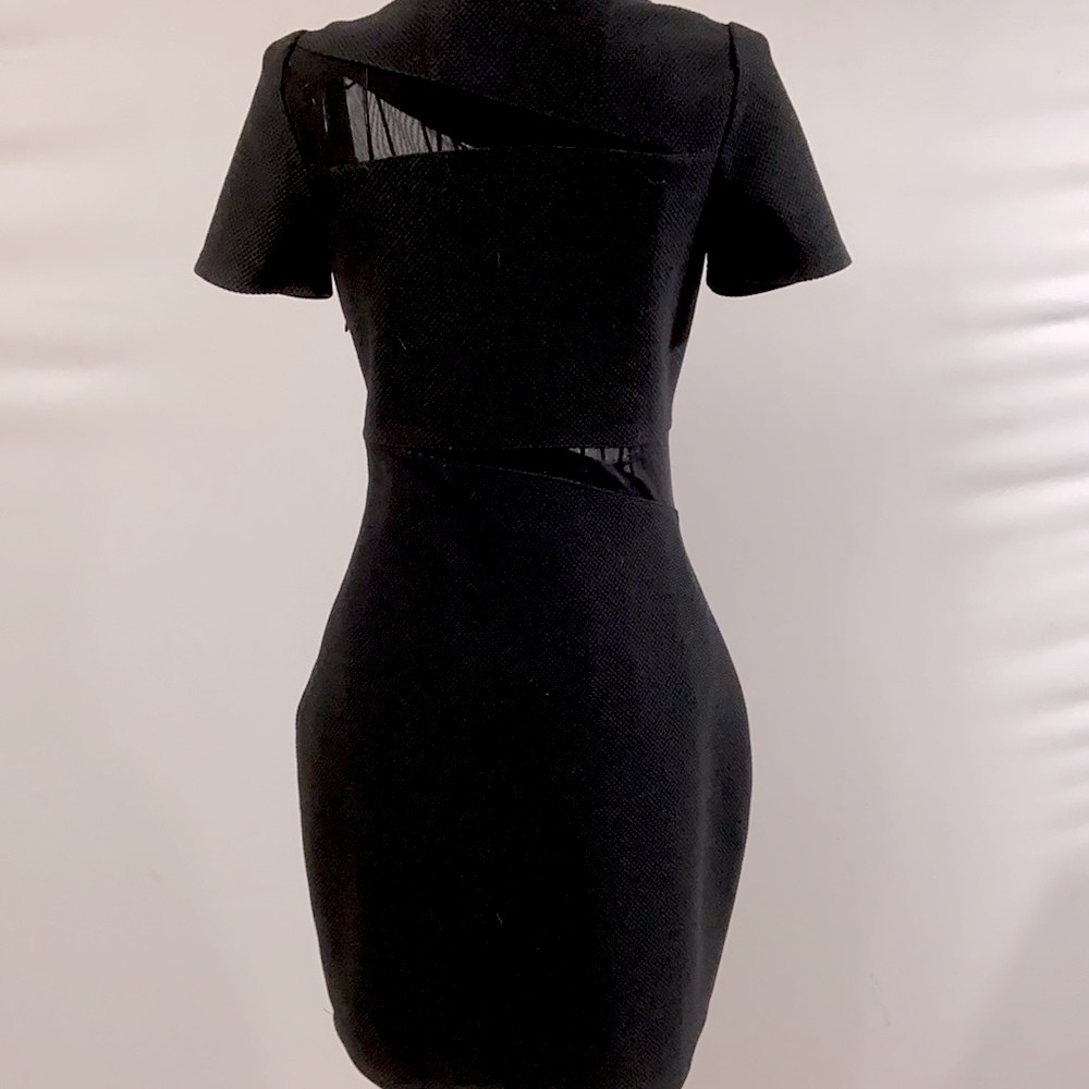 Black body con dress with peekaboo mesh panels. Perfect LBD